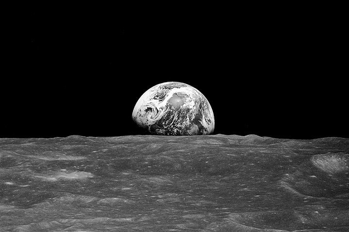 Here we see the well-known "Earthrise" photo taken on the Apollo 8 mission. As NASA explains it, "On Dec. 24, 1968, Apollo 8 astronauts Frank Borman, James Lovell, and William Anders were coming around from the far side of the Moon on their fourth orbit. Borman began to roll the spacecraft, and as he did, the Earth rose into view over the Moon’s limb. Anders, photographing the Moon from the right side window, caught sight of the view and exclaimed: 'Oh, my God, look at that picture over there! There’s the Earth comin’ up. Wow, is that pretty!' He snapped a black-and-white photo, capturing humanity’s first view of Earth from another planetary body." 
Source: Bill Anders/NASA
