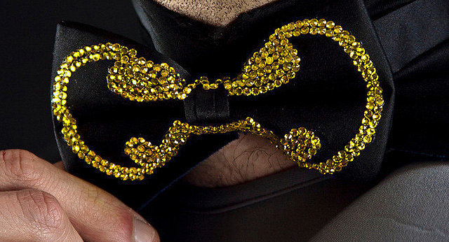 <a href="https://www.etsy.com/listing/126726128/the-gotham-playboy-bowtie-black-satin">Rhinestone Batman Bowtie</a> ($65)