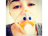 Miley Cyrus Wears Duck-Face Oxygen Mask, Postpones U.S. Bangerz Tour