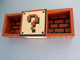 Super Mario Bros. shadow box shelf ($69)? We'll take five, thank you. 
