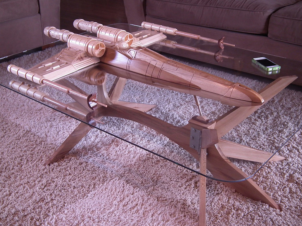 Oh this? No big deal, it's just a one-of-a-kind Star Wars X-wing coffee table ($5,500) straight outta your dreams.
